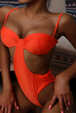 Orangefarbene, sexy Urlaubs-Bademode im Patchwork-Stil