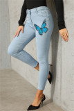 Graue, modische, lässige Schmetterlingsdruck-grundlegende Skinny Denim-Jeans mit mittlerer Taille
