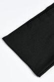 Bendaggio solido nero sexy scavato patchwork trasparente asimmetrico senza maniche in due pezzi