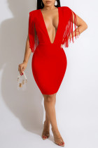 Vestidos de falda de un paso con cuello en V de retazos de borla sólida sexy de moda roja