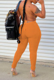 Yellow Sexy Solid Patchwork Frenulum Backless Regular Jumpsuits