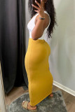 Vestidos de falda de un paso con cuello en V de frenillo de retazos ahuecados sólidos sexy amarillo