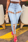 Atadura sólida de rua azul clara escavada patchwork jeans de cintura alta