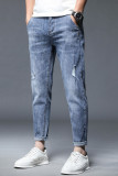 Jeans strappati casuali blu rendono vecchi jeans in denim a vita media patchwork