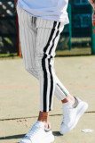 Pantaloni a matita a vita media con patchwork a righe casual bianco alla moda