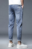 Blauwe casual gescheurde oude patchwork jeans met halfhoge taille