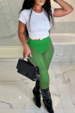 Pantaloni tinta unita a vita alta regolari trasparenti con patchwork tinta unita verde