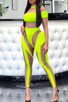 Macacão skinny verde fluorescente fashion patchwork transparente com gola O
