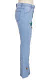 Jeans de mezclilla regular de cintura alta rasgados con bordado casual de moda azul