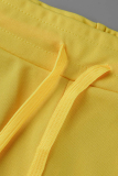 Duas peças amarelas estampadas patchwork com decote em O sem mangas