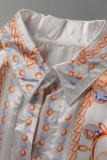 タンジェリンレッドファッションカジュアルプリント包帯パッチワークVネックワンステップスカートドレス