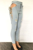 Lichtblauwe mode casual effen gescheurde bandage uitgeholde hoge taille skinny denim jeans