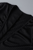 Barboteuse décontractée à la mode noire avec ceinture et col en V