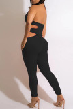 Zwarte mode sexy effen uitgeholde backless halter skinny jumpsuits