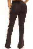 Calças pretas moda casual sólida vazada com fenda e cintura alta