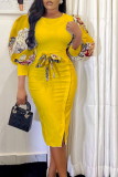 Vestidos de falda de lápiz con cuello en O de patchwork con estampado de moda amarillo