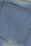 Jupe en jean bleu clair à la mode décontractée à pampilles solides de grande taille