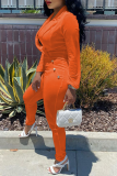 オレンジファッションソリッドパッチワークターンダウンカラーレギュラージャンプスーツ