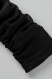 Schwarzer, sexy, fester, durchsichtiger Patchwork-Overall mit schrägem Kragen