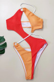 Trajes de baño de contraste sin espalda ahuecados sólidos de retazos sexy de moda naranja (con rellenos)