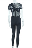 Zwarte mode sexy effen patchwork doorschijnende skinny jumpsuits met O-hals