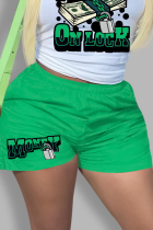 Grüne Mode-Print-Patchwork-Unterteile mit gerader mittlerer Taille und gerader Positionierung