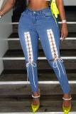 Jeans de mezclilla de cintura alta de patchwork ahuecados de vendaje sólido de calle sexy azul claro