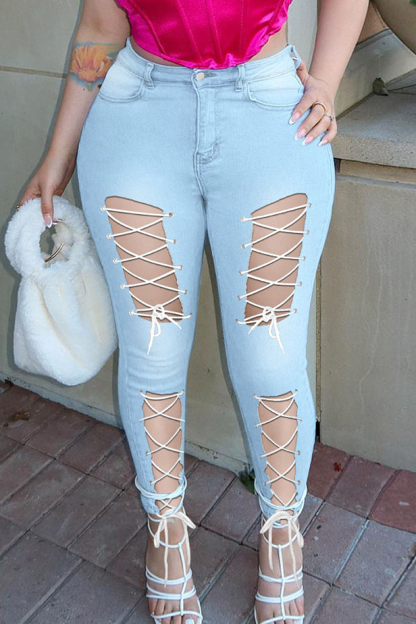 Lichtblauwe Sexy Street Solid Bandage Uitgeholde Patchwork Hoge Taille Denim Jeans