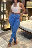 Jeans skinny in denim a vita alta con spacco patchwork con stampa di farfalle blu scuro