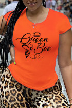 オレンジファッションストリートプリントパッチワークOネックTシャツ