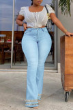 Jeans de mezclilla de cintura alta con retazos de borlas sólidas de calle casual azul