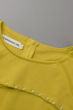 Gelber eleganter fester Patchwork-Volant, der O-Hals-einstufigen Rock-Kleider bördelt