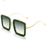 Solide Patchwork-Sonnenbrille in Grün