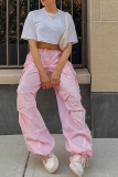 Pantaloni in tinta unita Harlan a vita media con motivo patchwork in tinta unita rosa