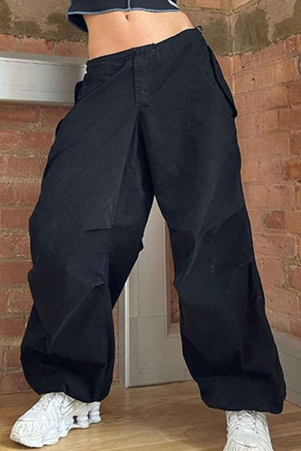Calças retas de cor sólida preta casual de retalhos de bolso solta cintura média