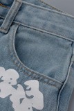 Jeans blu casual in denim a vita alta con stampa patchwork