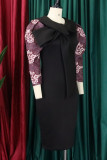 Vestidos de saia de um passo preto elegante estampado com laço e decote