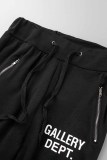 Calças de cintura média com estampa de rua preta