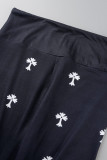 Zwarte casual kokerbroek met patchworkprint en hoge taille