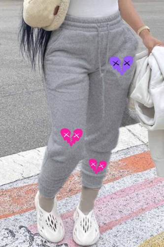 Pantaloni larghi con patchwork con stampa street grigio chiaro