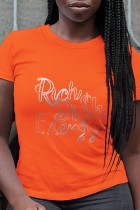 Magliette casual arancioni con stampa quotidiana patchwork lettera O collo