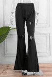 Pantalones casuales de color liso con corte de bota de corte de bota de retazos rasgados sólidos de calle de color negro