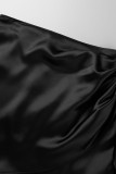 Fondo di colore solido asimmetrico a vita alta con patchwork di fasciatura solida nera sexy