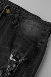 La nappa solida nera da strada strappata crea vecchi jeans in denim a vita alta patchwork