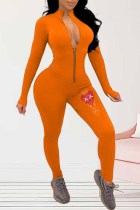Oranje jumpsuits met patchwork-ritskraag en sportkledingprint