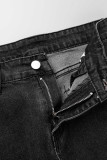 Jeans in denim a vita alta patchwork con stampa scozzese nera
