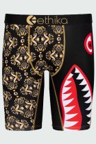Pantalones de lápiz de cintura baja con letras de retazos con estampado sexy de oro negro