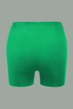 Pantalones casuales con estampado de patchwork de cintura alta con estampado de posicionamiento de lápiz verde