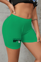 Pantaloni con stampa di posizionamento a matita a vita alta patchwork con stampa casual verde