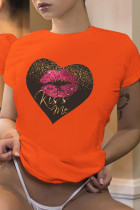 Oranje casual straatlippen bedrukte patchwork T-shirts met letter O-hals